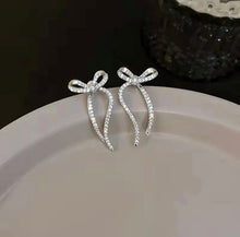 Load image into Gallery viewer, Sparkly Silver Bow Earrings
